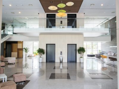 Empty lobby of condominium building. Elevators in hall of modern business center. Stylish interior design concept